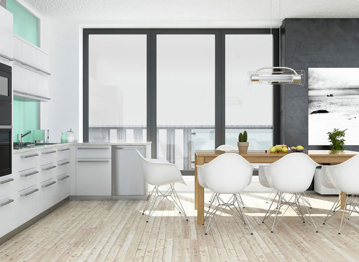A modern kitchen and dining area with a white table and white chairs